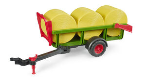 Self loading bale trailer